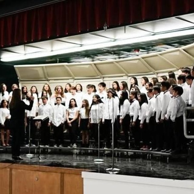 The choir team perfectly executes an amazing performance, blowing the audience away.
