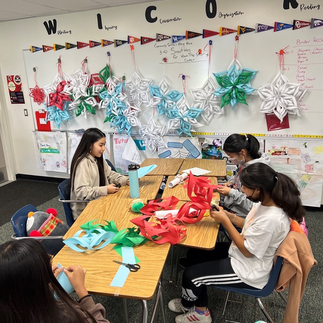 Our AVID students are making snow flakes for the Senior Center.